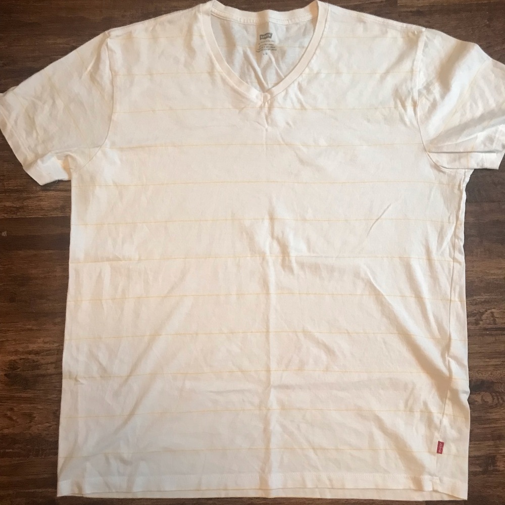 Levi’s Women’s white striped shirt with pale yellow
Stripes, size large